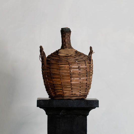 DAMAJUANA DE VIDRIO Y MIMBRE, AÑOS 20